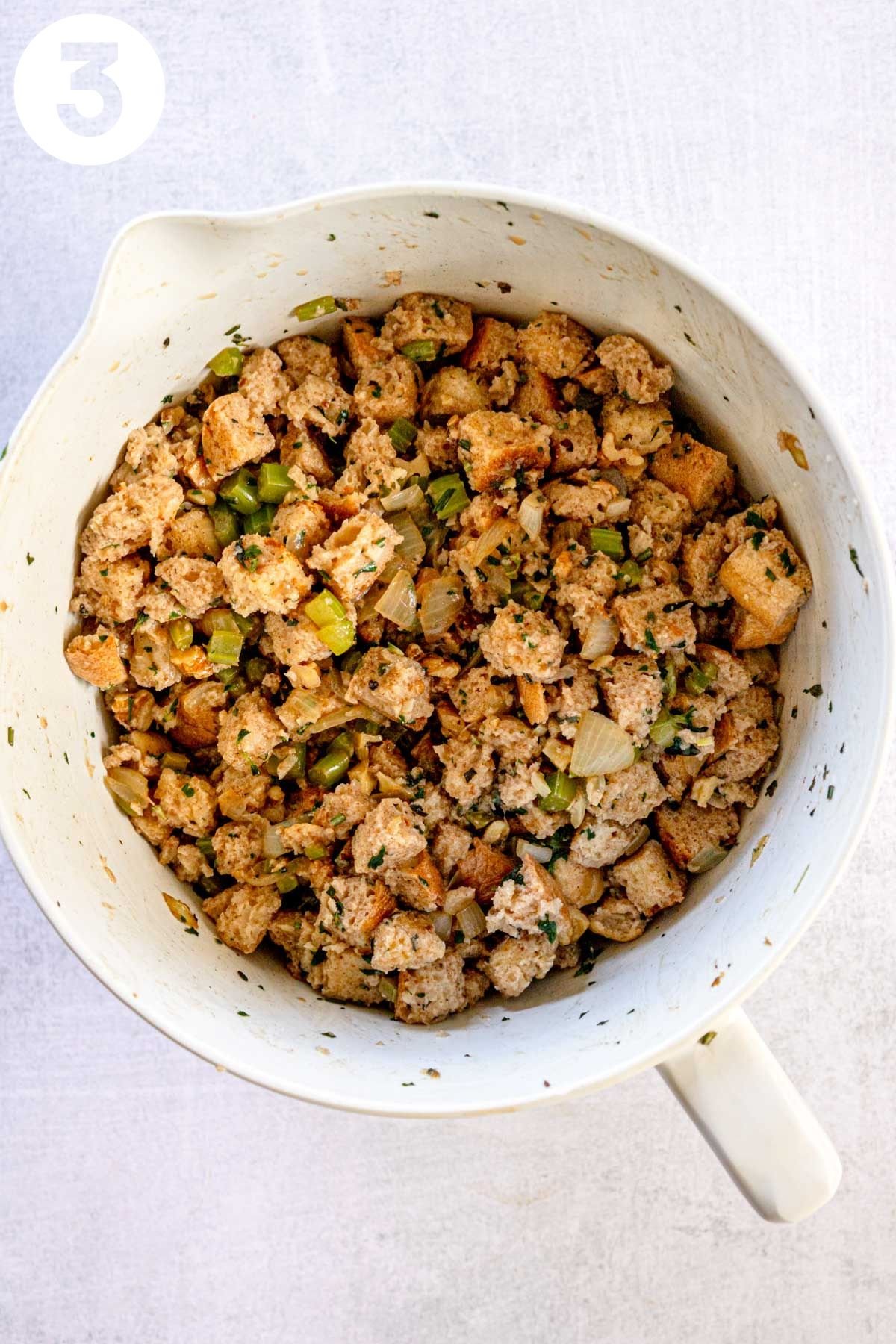 Vegetarian stuffing ingredients in a large mixing bowl, labeled "3."