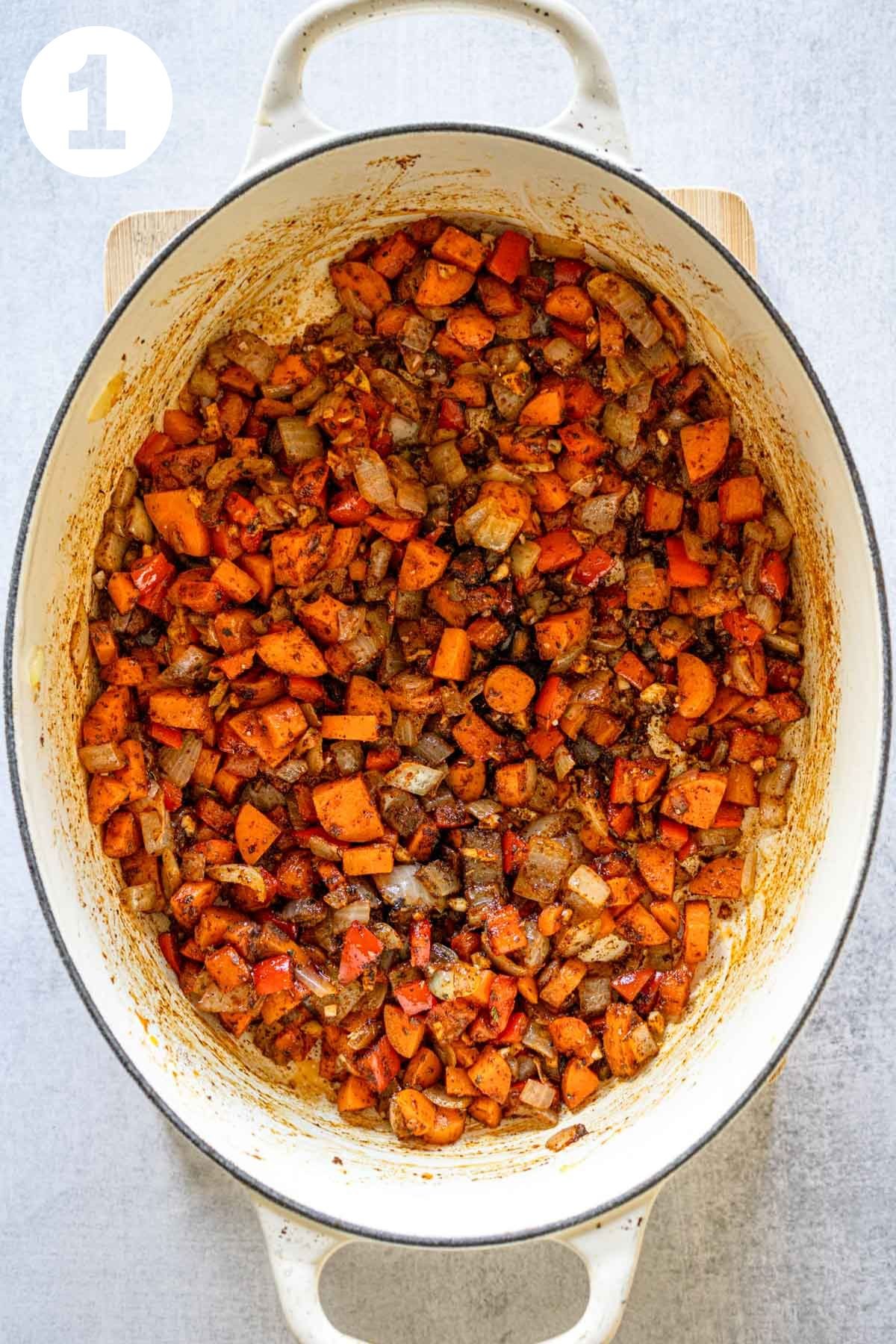 Sautéed onion and bell pepper with spices to make vegetarian chili.