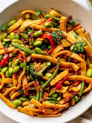 Vegetable stir-fry with edamame and noodles.