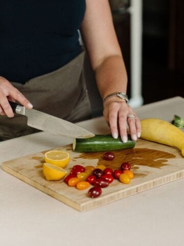 Stephanie McKercher, a registered dietitian, chopping vegetables in her kitchen.