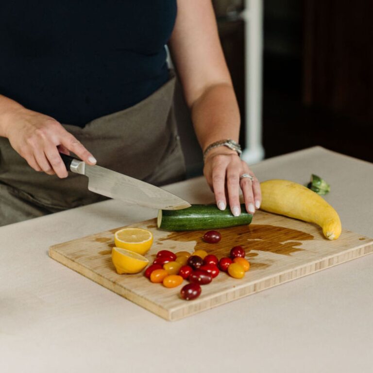 Stephanie McKercher, a registered dietitian, chopping vegetables in her kitchen.