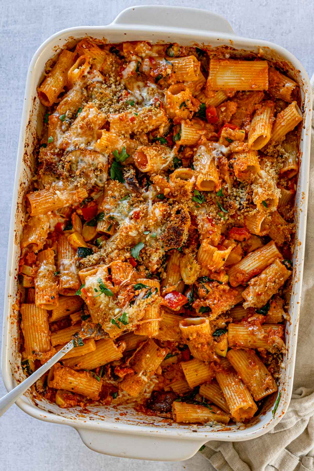 Vegetable baked pasta with rigatoni in a casserole dish.