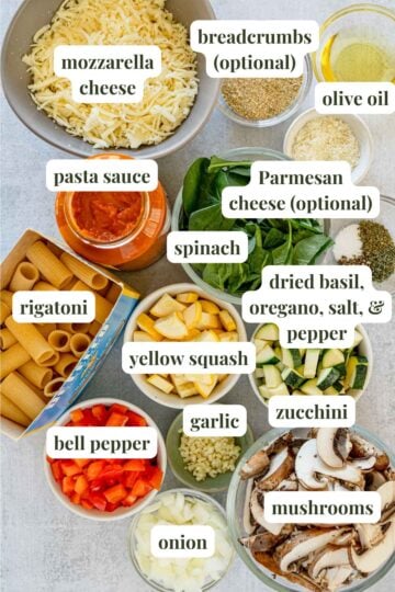 Labeled ingredients to make a baked pasta with vegetables and rigatoni.