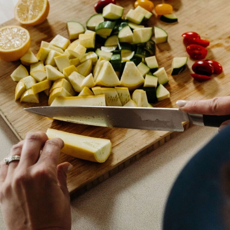Cutting yellow squash, zucchini, tomatoes, and lemon.