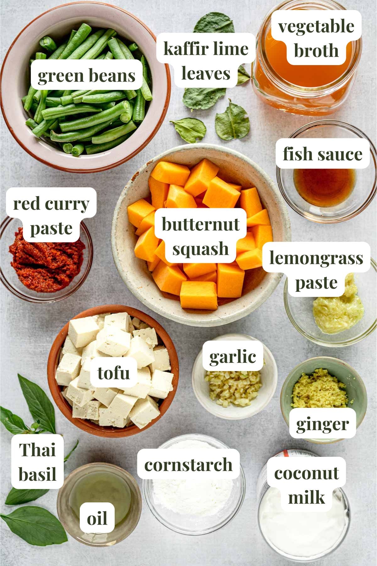 Labeled ingredients to make Thai red curry with crispy tofu and vegetables.