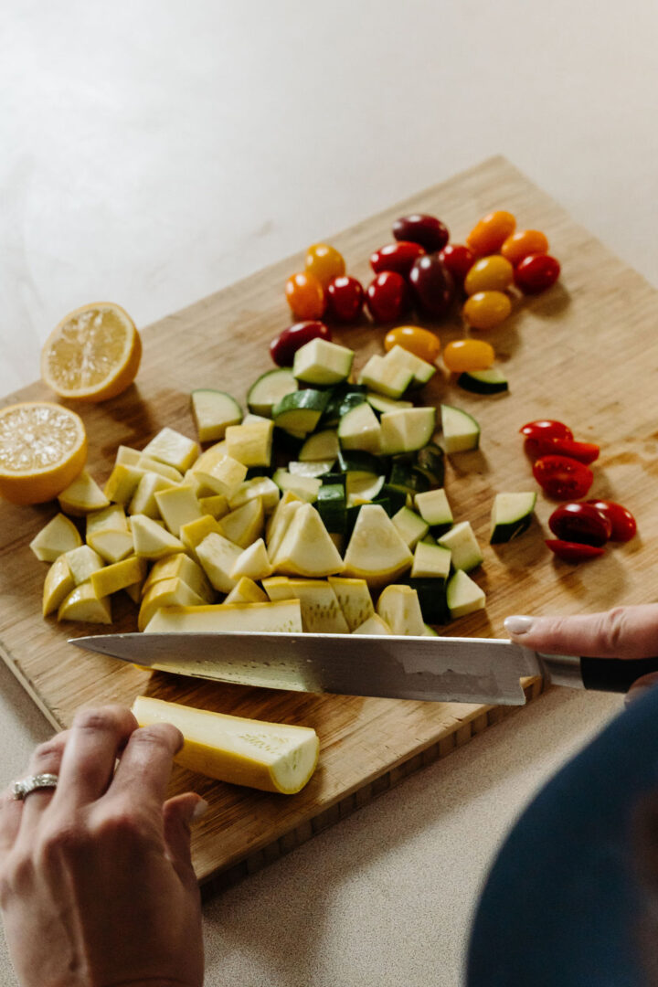 Chopping vegetables on a wood cutting board