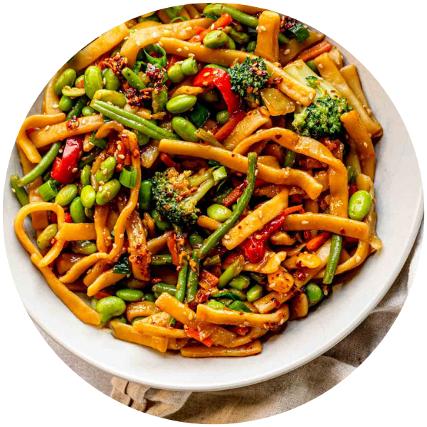 Circular image of veggie stir-fry with noodles