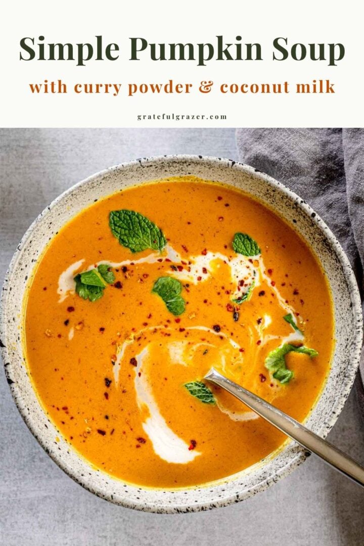Curried pumpkin soup with coconut milk, herbs, and red pepper flakes. Text reads, "Simple Pumpkin Soup with curry powder and coconut milk."