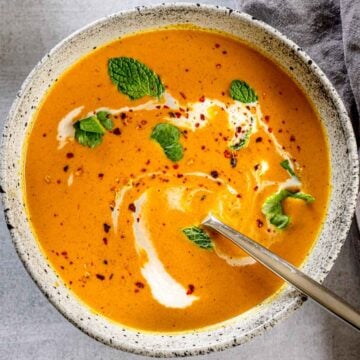 A bowl of pumpkin soup with curry powder and coconut milk.